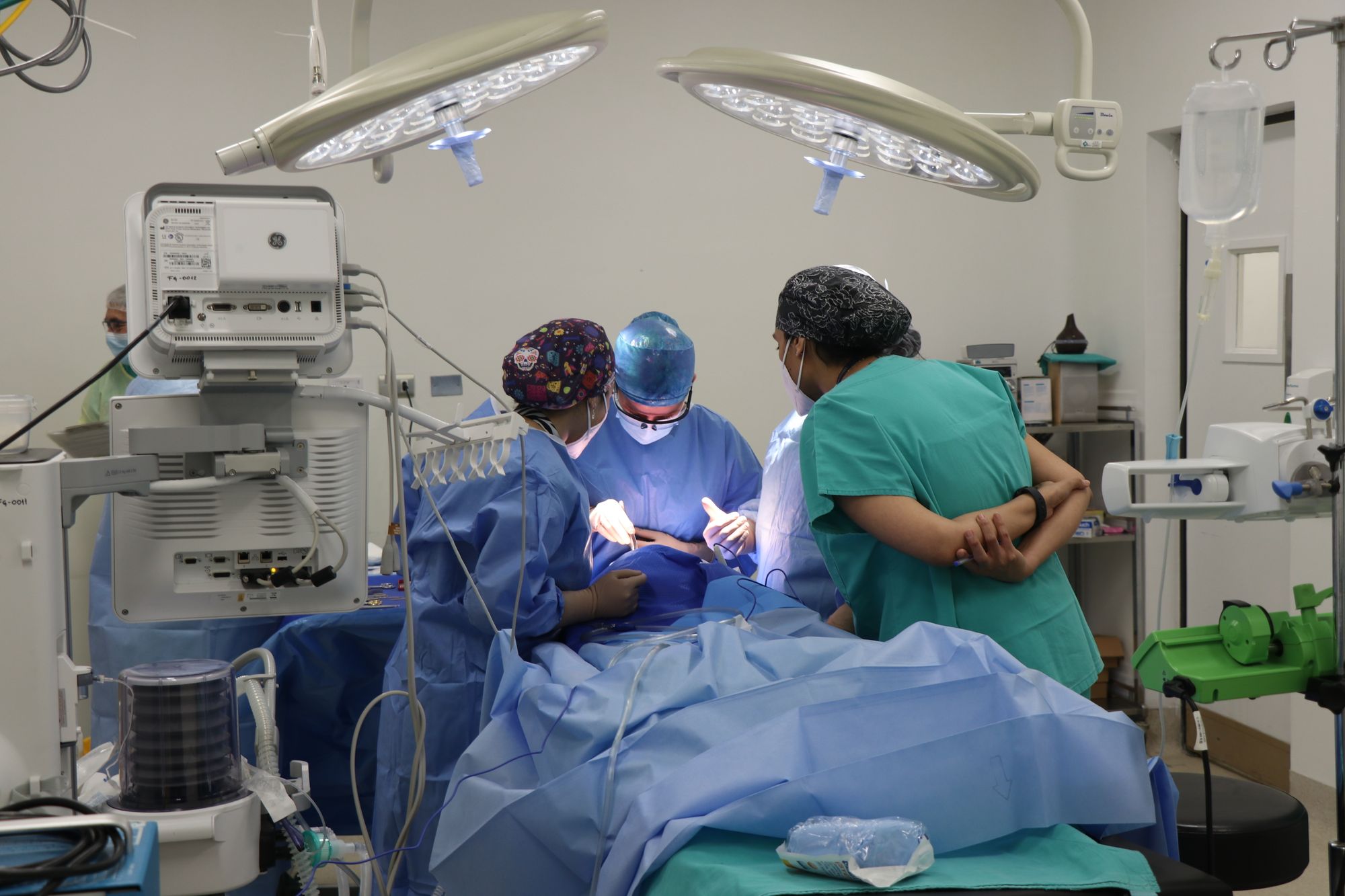Anesthesia and surgical team working together in an operating room